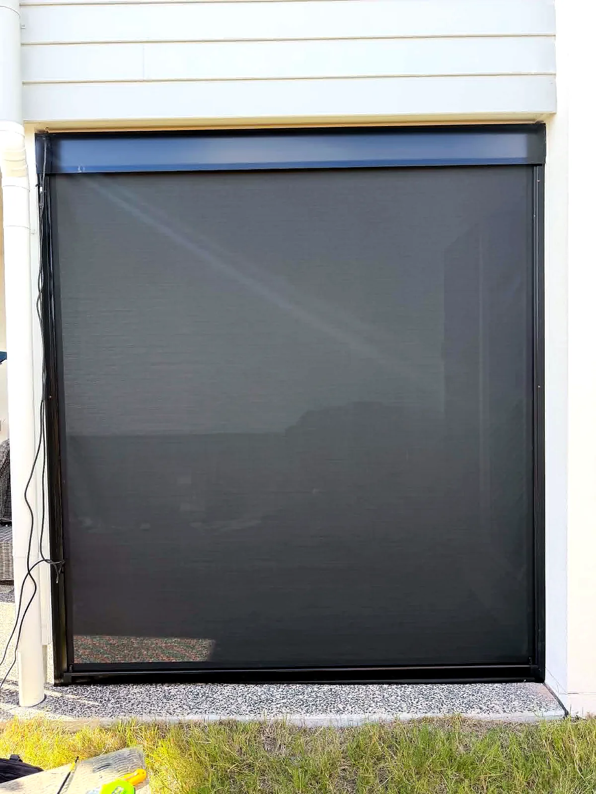 Outdoor zip screen blind installed over an alfresco opening in Brisbane